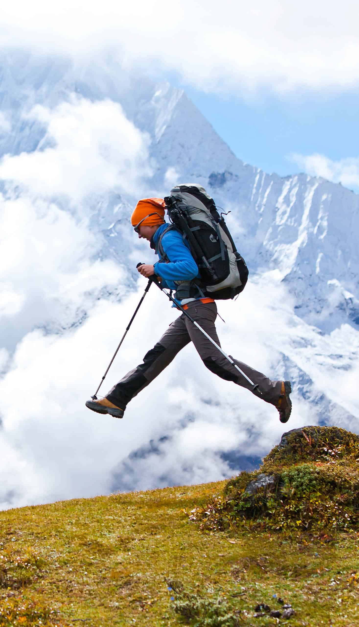 A hiker jumping in the Himalayas.
