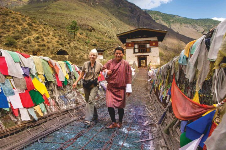 A tourist and a guide in Paro Valley in Bhutan.