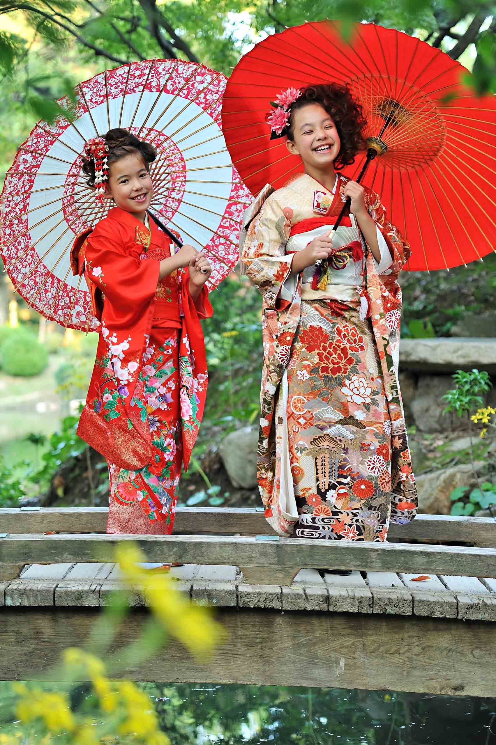 Two girls wearing kimonos.