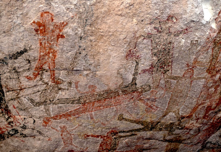 A cave painting showing various human figures in red and brown hues engaging in different activities on a textured stone surface, takes you on a historical journey, almost like time travel.